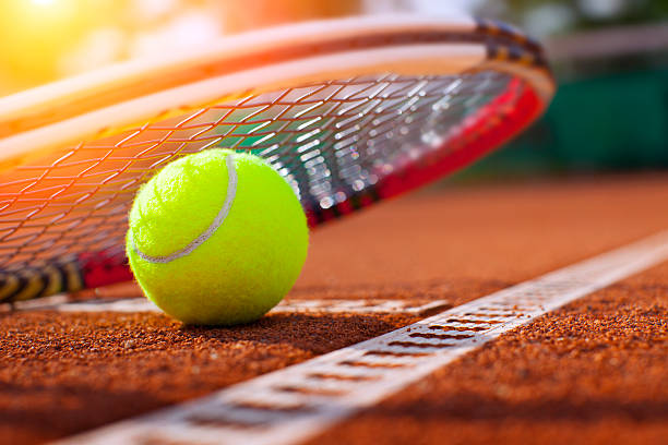 tennis ball on clay court